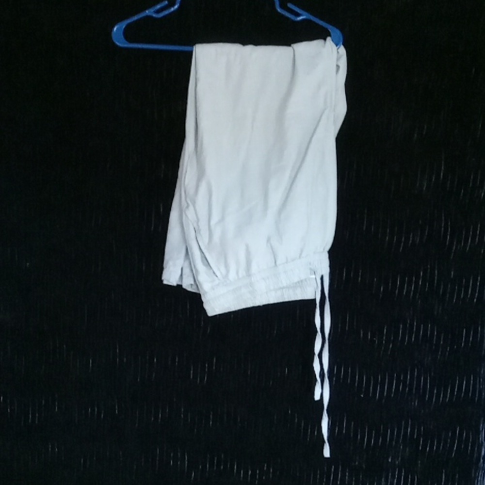 A nice 100% cotton material, with draw string.  35 inches long.